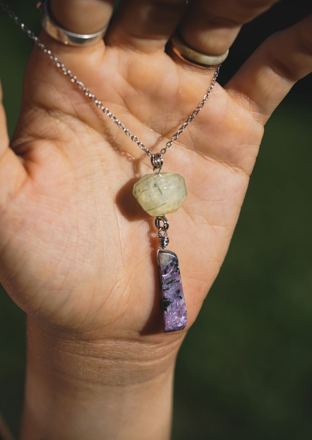 This gorgeous Prehnite stone is about .35" long, while the Charoite is approximately .65" long, both suspended from a 20" long stainless steel chain. In addition, I infuse each of my handcrafted crystal designs with Reiki energy and charge and clear them with sunlight, moonlight, and sage, which amplifies not only the stones but your intentions as well. This necklace came to be for a specific person and situation, there are no coincidences, so if you stumbled across this page, maybe it was meant for you:)
