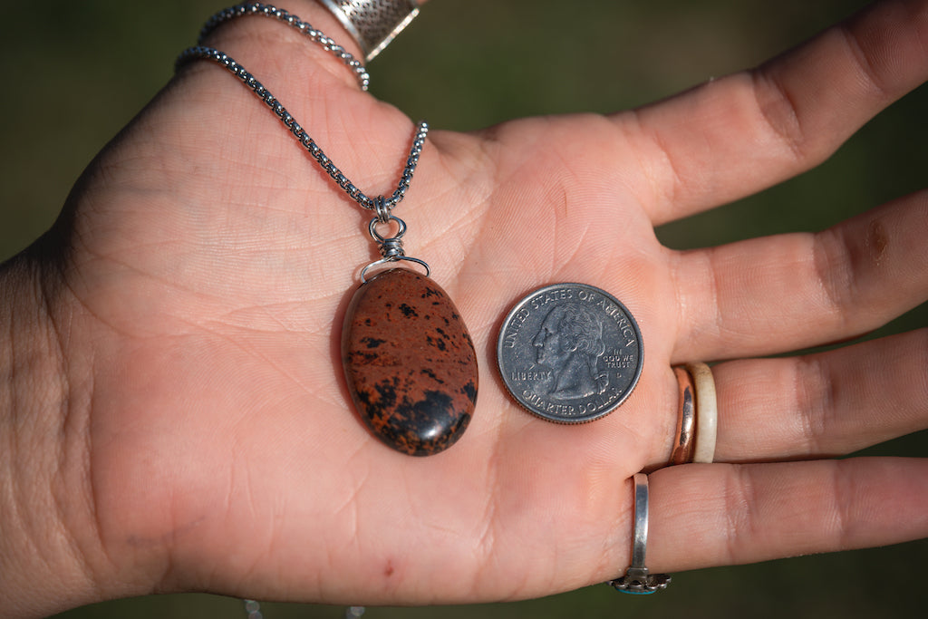 'Creating Meaning’ Mahogany Obsidian Medallion Stainless Steel Necklace