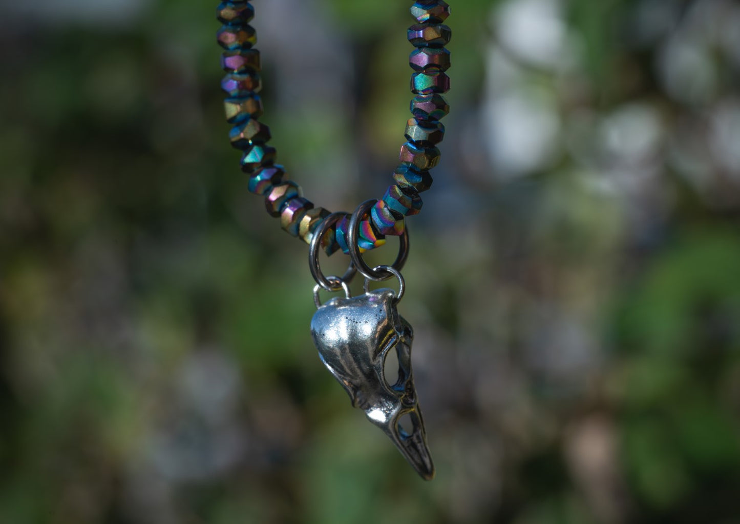 'Happy Place’ Faceted Rainbow Titanium Quartz & Bird Skull Stainless Steel Necklace